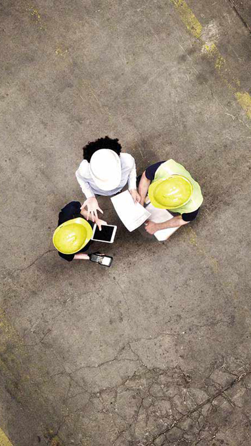 Aerial view of industrial workers meeting