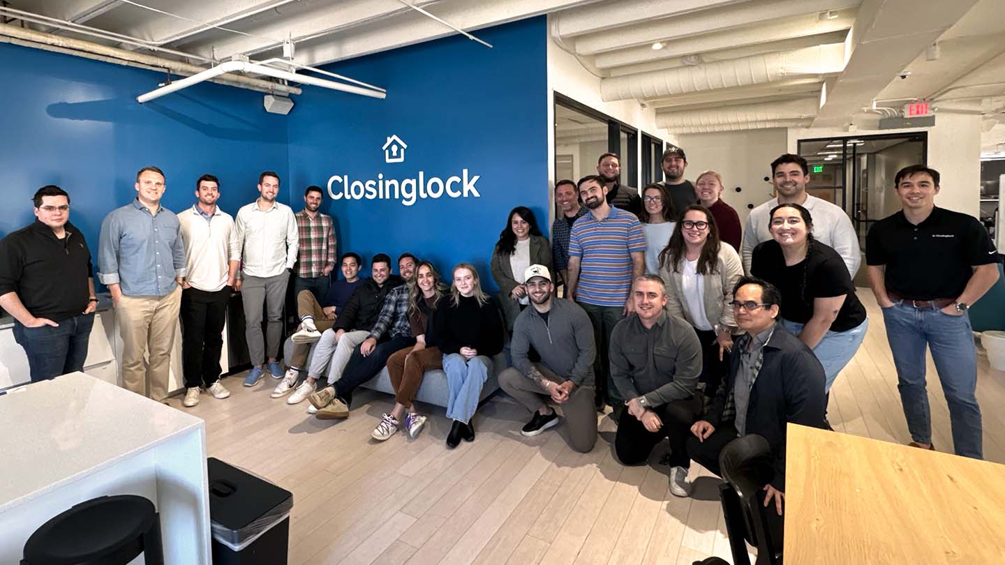 A group of people standing in front of the Closinglock logo