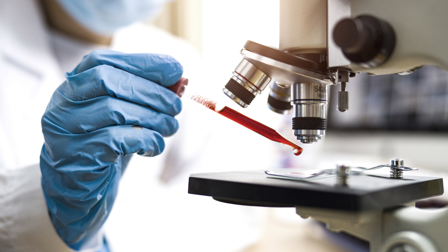 scientist using medical equipment banner