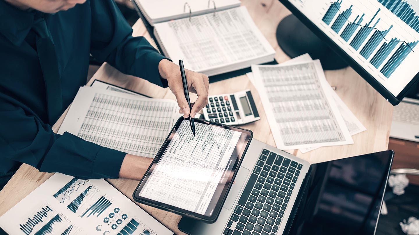 Man doing data analysis on tablet