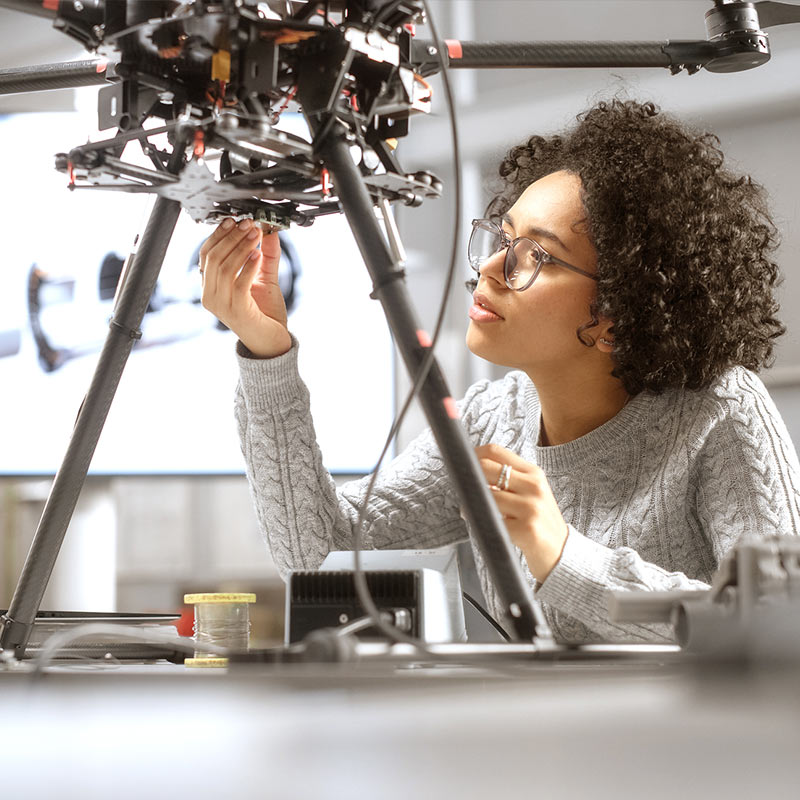 Woman working on a piece of equipment