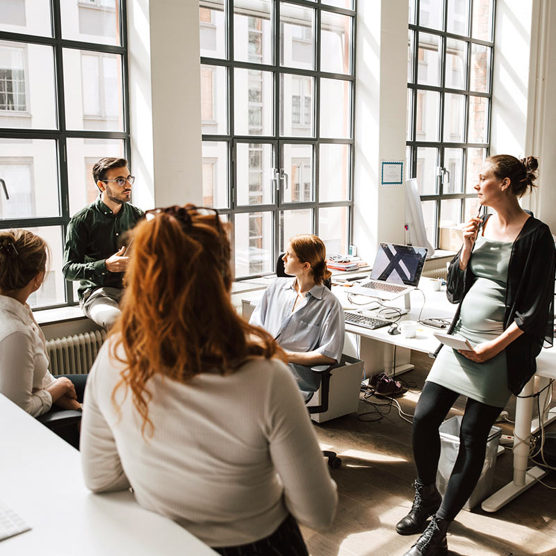 Individuals collaborating in group environment