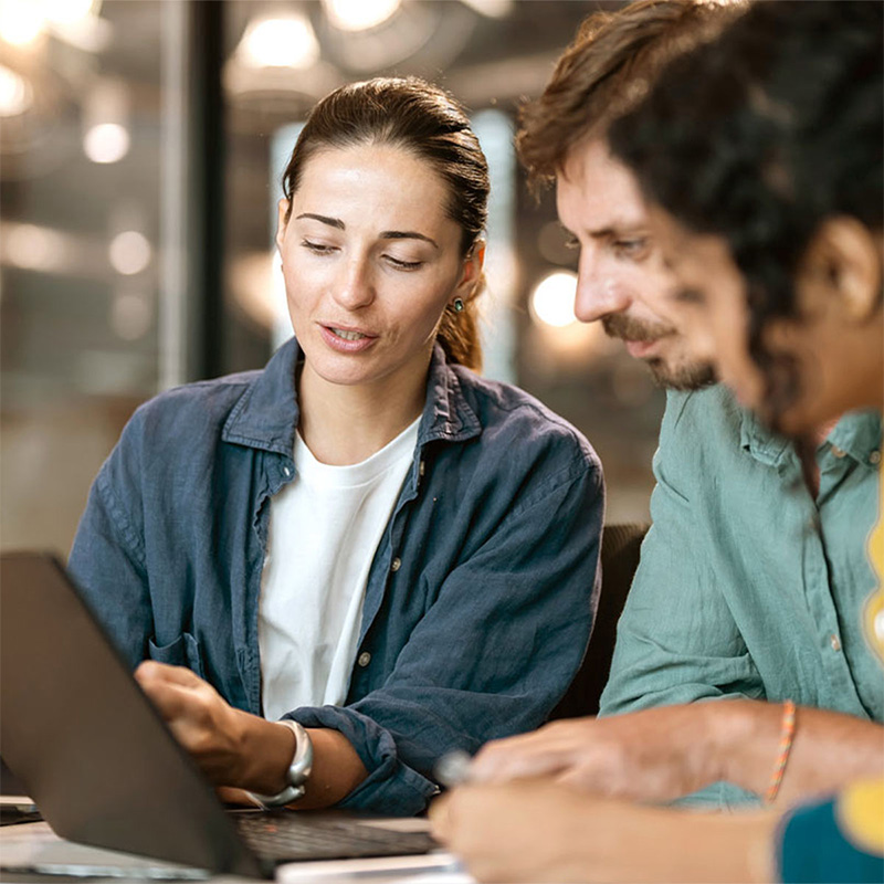 3 people meeting using a laptop banner