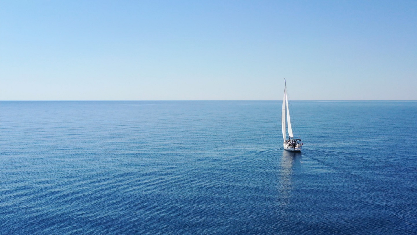 Aerial view of sailing luxury yacht at opened sea at sunny day in Croatia, view from drone