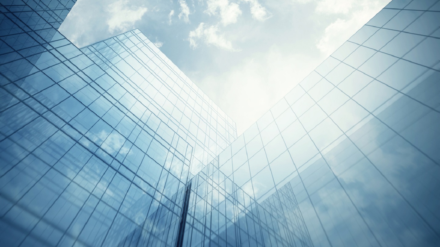 Blue clean glass wall of modern skyscraper