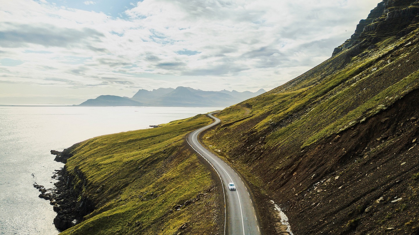 car driving on beautiful road, travel background, aerial scenic landscape from Iceland