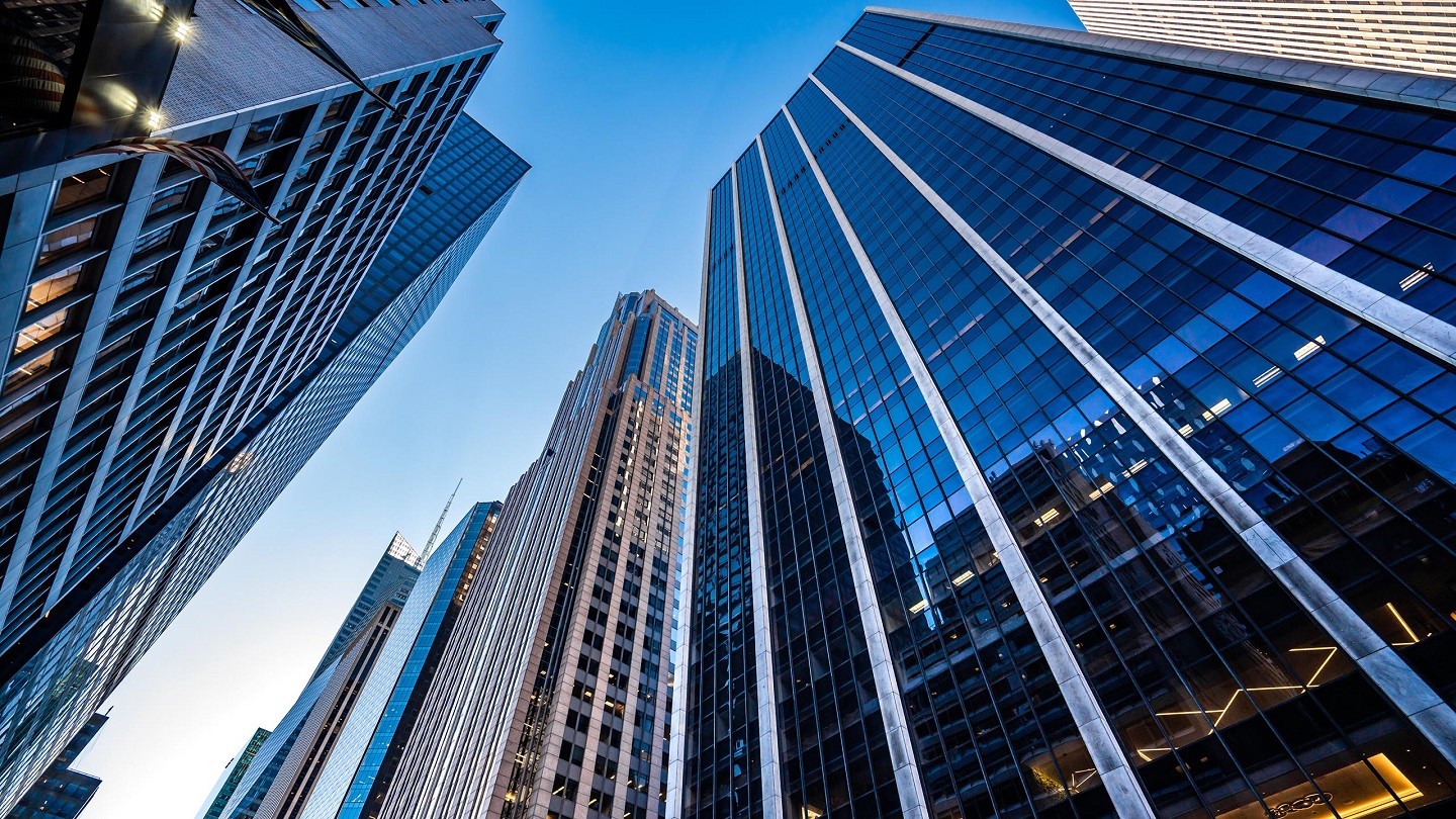 Low angle view of modern skyscrapers in Midtown Manhattan.