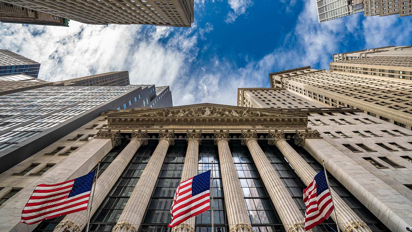 Financial district city buildings outside the New York Stock Exchange building on Wall Street 
on October 10, 2019 in New York