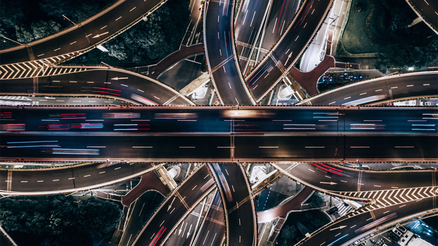 Aerial View of Overpass and City Traffic at Night / Shanghai, China